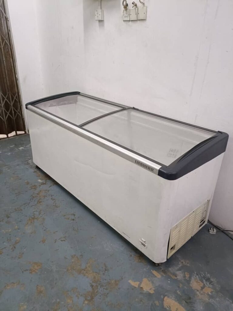 Technician repairing freezer not cooling problem in Kuala Lumpur Malaysia